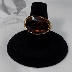 Golden ring of leaves & dark brown stone